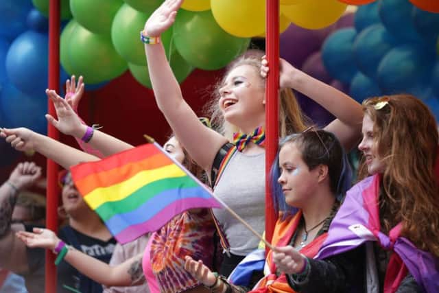 People take part in the Pride Glasgow parade. Picture: David Cheskin/PA Wire
