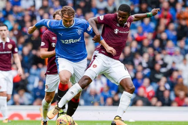 Rangers' Niko Kranjcar and Hearts' Arnaud Djoum tussle. Picture: SNS/Alan Harvey