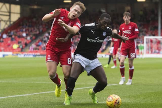 Aberdeen's Greg Stewart battles with Roarie Deacon. Picture: SNS/Ross Parker