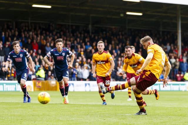 Motherwell's Louis Moult scores from the penalty spot to make it 2-0. Picture: SNS/Roddy Scott