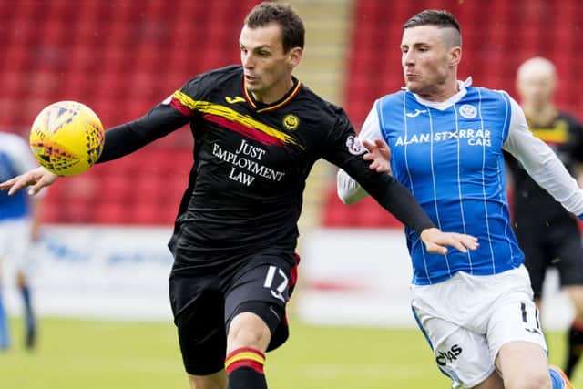 Partick Thistle's Milan Nitriansky holds off St Johnstone's Michael O'Halloran. Picture: SNS/Alan Rennie
