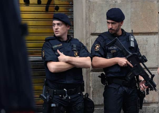 Police officers stand guard on Las Ramblas boulevard in Barcelona on August 19, 2017, two days after a van ploughed into the crowd, killing 13 persons and injuring over 100. Picture: Getty Images