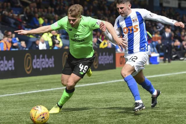 Celtic's James Forrest evades Greg Taylor. Picture: SNS/Craig Williamson