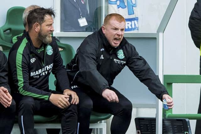Neil Lennon jumps off his seat in the dugout as his Hibs team struggle to contain Hamilton. Picture: SNS.
