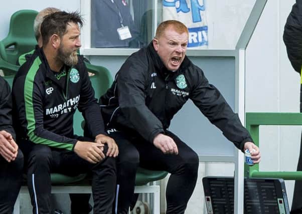 Neil Lennon jumps off his seat in the dugout as his Hibs team struggle to contain Hamilton. Picture: SNS.
