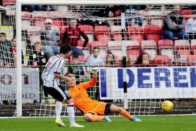 Joe Cardle scores his second goal to add the gloss to Dunfermlines victory. Picture: Michael Gillen.