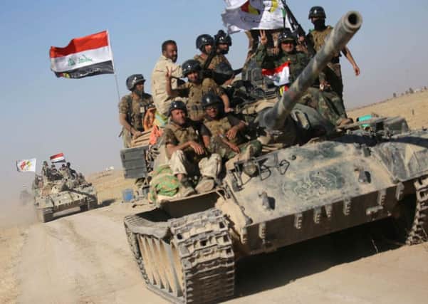 Iraqi government forces supported by fighters from the Abbas Brigade, advance towards the city of Tal Afar, the main remaining stronghold of the Islamic State group. Picture: MOHAMMED SAWAF/AFP/Getty Images