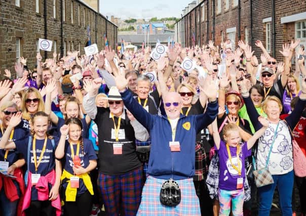 Sir Tom Farmer with some of 2,000-plus people who took part in the charity fundraiser Dundee Royal Bank of Scotland Kiltwalk. Picture: Elaine Livingstone/Contributed