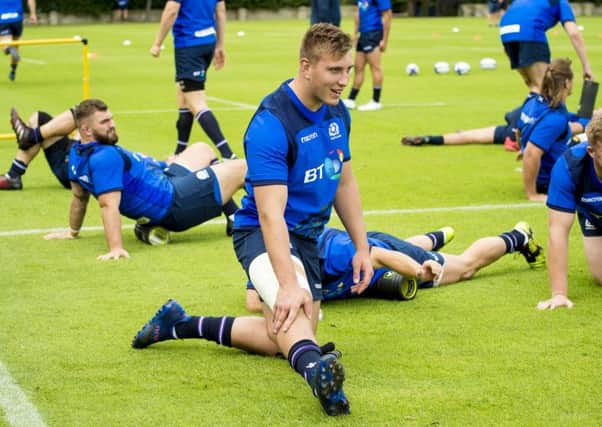 Matt Fagerson does some stretching exercises at the Scotland training camp. Picture: SNS/SRU.