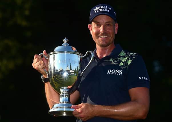 Henrik Stenson poses with the trophy after winning the Wyndham Championship. Picture: Getty.