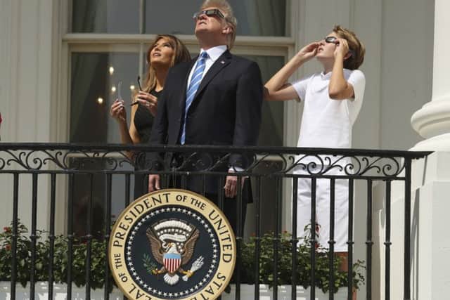 President Donald Trump, first lady Melania Trump and their son Barron watch the solar eclipse.  (AP Andrew Harnik)