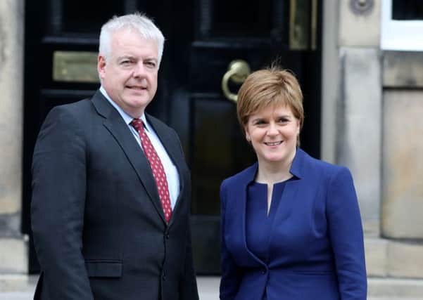 First Minister of Scotland Nicola Sturgeon and First Minister of Wales Carwyn Jones meet on the steps of Bute House. Picture: PA