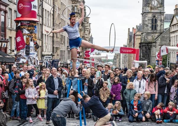 Fringe performer entertaining the crowd on the High Street to the enjoyment of all.



Picture: Curtis Welsh