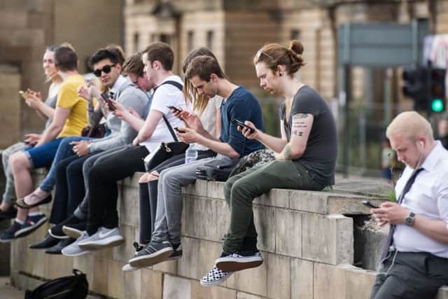 Consumers are holding on to older mobile models for longer. Picture: John Devlin
