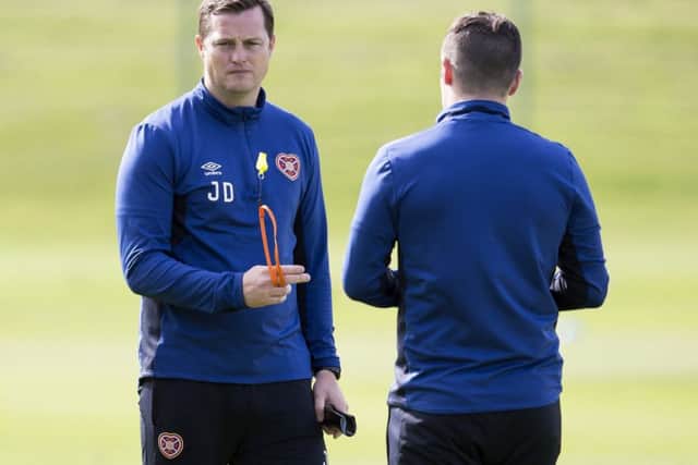 Jon Daly oversees training ahead of the weekend trip to Fir Park. Picture: SNS