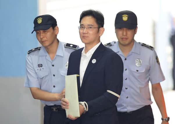 Lee Jae-yong, Samsung Group heir arrives at Seoul Central District Court to hear the bribery scandal verdict. Picture: Chung Sung-Jun/Getty Images