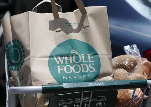 Amazon will cut the price of Whole Foods products such as bananas, avocados, eggs and salmon. Picture: Rogelio V Solis/AP