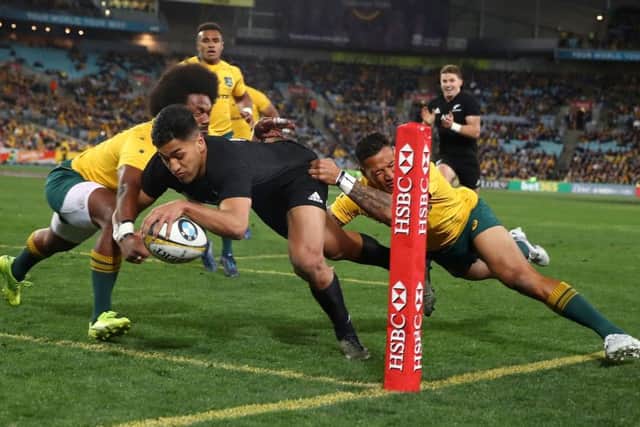 Rieko Ioane scores one of New Zealands eight tries against Australia. Picture: Mark Kolbe/Getty Images