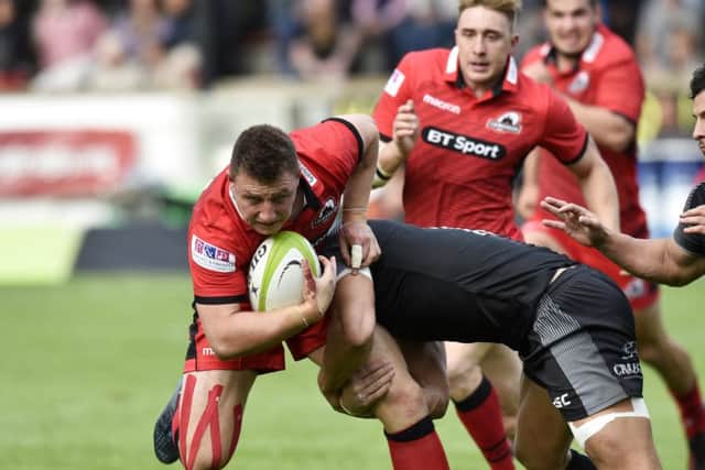Edinburgh stand-off Duncan Weir tries to force his way through the Falcons rearguard. Picture: SNS.
