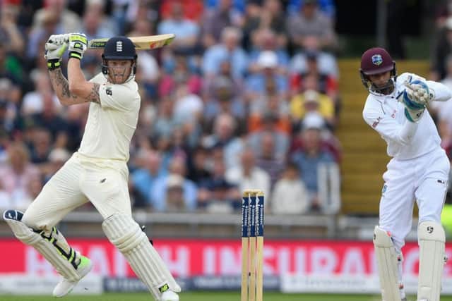 England batsman Ben Stokes cuts a ball to the boundary watched by West Indies wicketkeeper Shane Dowrich at Headingley. Picture: Getty Images
