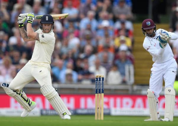 England batsman Ben Stokes cuts a ball to the boundary watched by West Indies wicketkeeper Shane Dowrich at Headingley. Picture: Getty Images