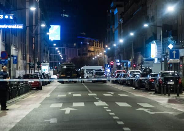 Policemen stand guard the Boulevard Emile Jacqmain - Emile Jacqmainlaan in the city centre of Brussels where a man is alleged to have attacked soldiers with a knife and was shot. Picture: AURORE BELOT/AFP/Getty Images