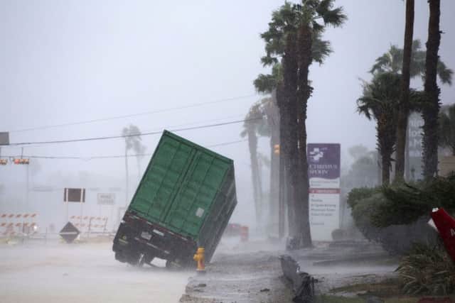 A power generator tips in front of a Texas' hospital. (Courtney Sacco /Corpus Christi Caller-Times via AP)