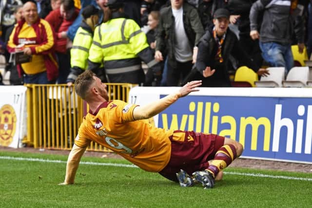 Motherwell's Louis Moult celebrates his goal to make it 2-1. Picture: SNS