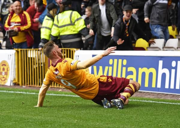Motherwell's Louis Moult celebrates his goal to make it 2-1. Picture: SNS
