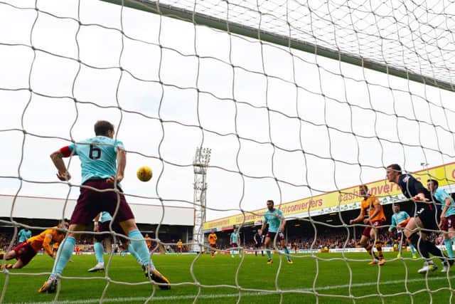 Hearts lead lasted just seven minutes as Ryan Bowman, left, stooped to head in Motherwells equaliser after a cross from Richard Tait had been nodded down by Louis Moult. Photograph: Rob Casey/SNS