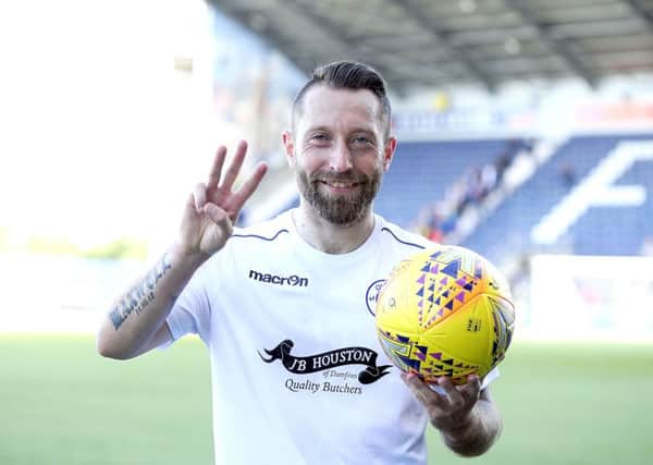 Stephen Dobbie with the match ball. Picture: Michael Gillen