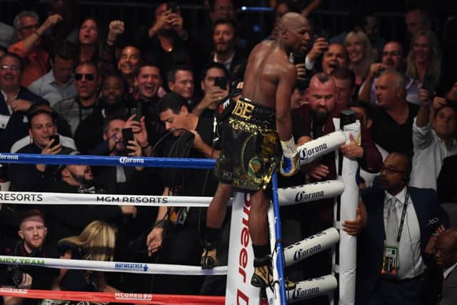 Floyd Mayweather celebrates after referee Richard Byrd stops the fight in the tenth round. File: Getty.