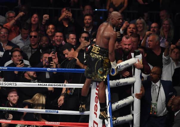 Floyd Mayweather celebrates after referee Richard Byrd stops the fight in the tenth round. File: Getty.