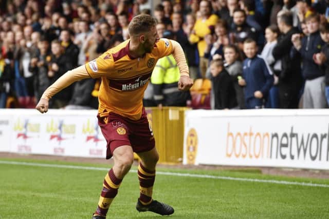 Louis Moult shows his delight after scoring the winning goal against Hearts. Picture: SNS.