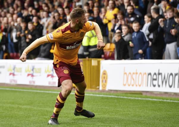Louis Moult shows his delight after scoring the winning goal against Hearts. Picture: SNS.