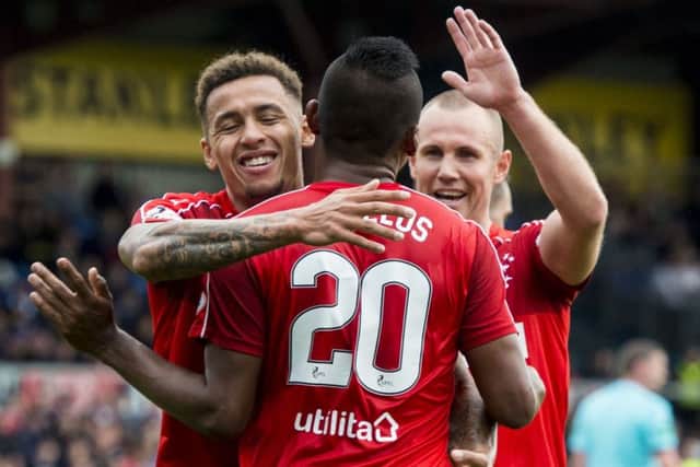 James Tavernier, left, celebrates with goalscorer Alfredo Morelos. Picture: SNS
