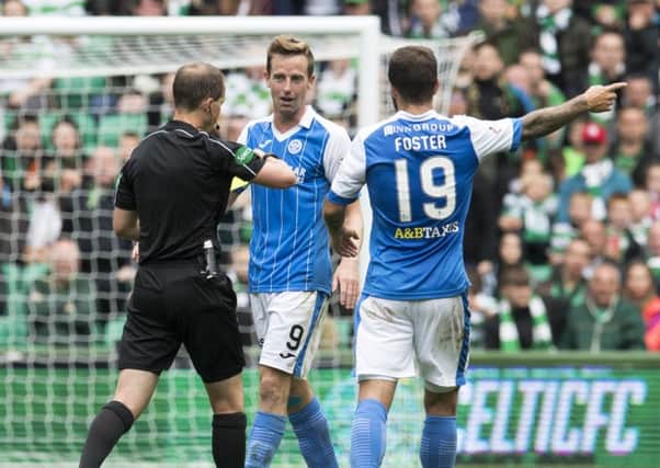 Steven MacLean is booked by Willie Collum at Celtic Park. Picture: SNS