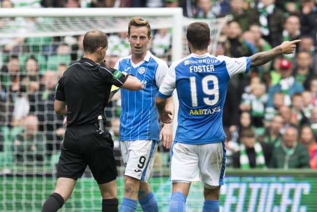 Steven MacLean is booked by Willie Collum at Celtic Park. Picture: SNS