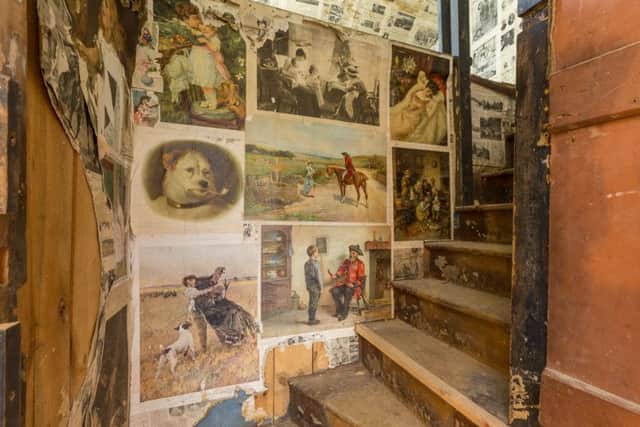 The stairs to the loft area which is decorated with pages from old newspapers and magazines. PIC: Daniel Wilcox/contributed.
