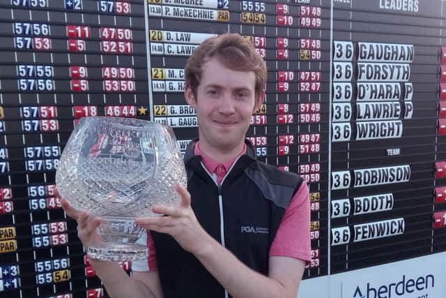 Louis Gaughan shows his prize after winning the Scottish Par-3 Championship..