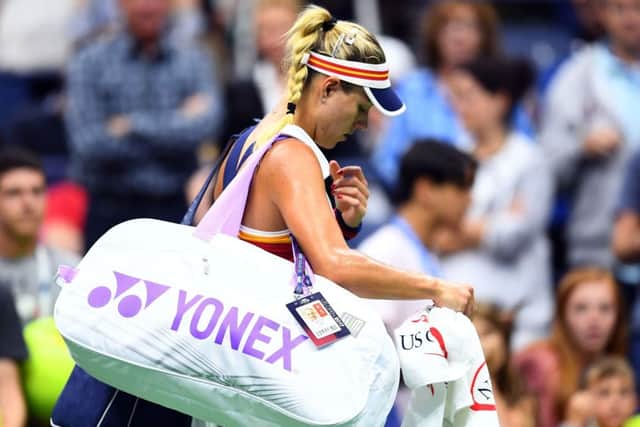 Dejected  Angelique Kerber leaves the court after her shock defeat by Naomi Osaka. Picture: AFP/Getty.