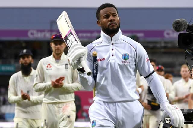 Twin centurion Shai Hope walks off in triumph after scoring the winning runs for West Indies against England at Headingley. Picture: Gareth Copley/Getty Images
