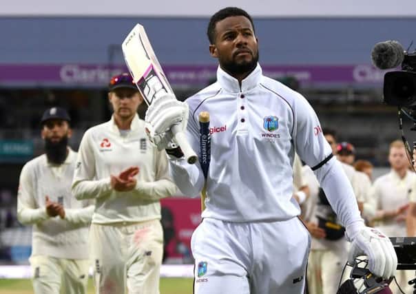 Twin centurion Shai Hope walks off in triumph after scoring the winning runs for West Indies against England at Headingley. Picture: Gareth Copley/Getty Images