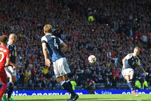 Leigh Griffiths scores from  a free-kick to put Scotland 2-1 up against England with only minutes to go at Hampden in June.