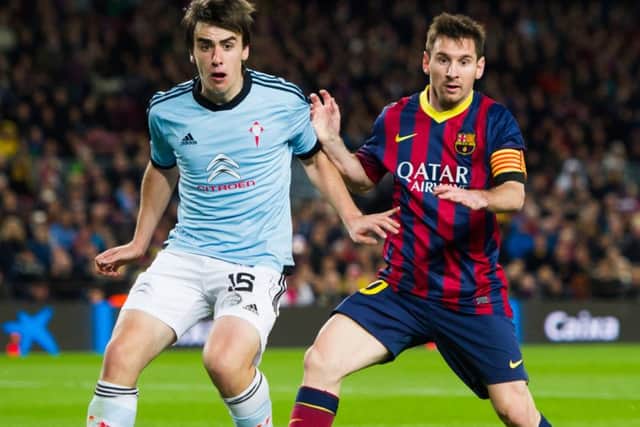 Dundee's new Spanish defender Jon Aurtenetxe has over 100 La Liga appearances under his belt. Here he is in action for Celta de Vigo against Lionel Messi and FC Barcelona in 2014. Picture: Alex Caparros/Getty Images