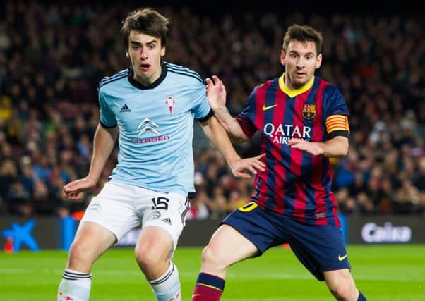 Dundee's new Spanish defender Jon Aurtenetxe has over 100 La Liga appearances under his belt. Here he is in action for Celta de Vigo against Lionel Messi and FC Barcelona in 2014. Picture: Alex Caparros/Getty Images