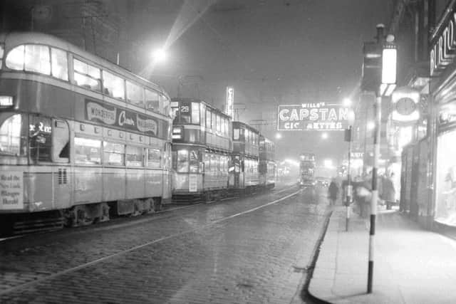 Glasgow by night - trams and neon signs in Argyll Street in  the 1950s. PIC: TSPL.