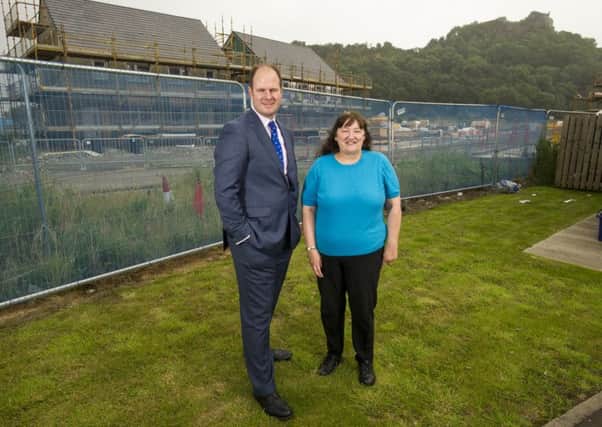 Bank of Scotland's Douglas Spowart with Forth Housing Association chair Margaret Turner. Picture: Chris Watt