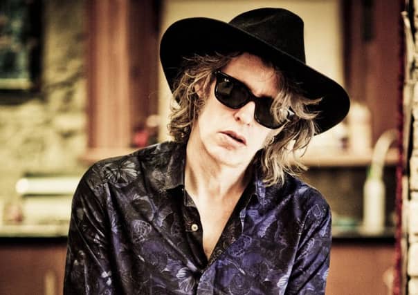 There are 23 tracks on Out of All This Blue by The Waterboys