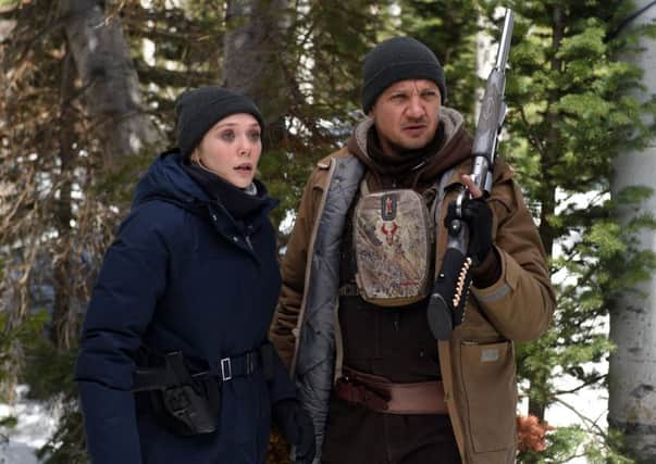 Elizabeth Olsen and Jeremy Renner in Wind River